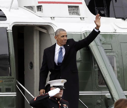 Former President Barack Obama waves as he boards a Marine helicopter during a departure ceremony on the East Front of the U.S. Capitol in Washington, Friday, Jan. 20, 2017, after President Donald Trump was inaugurated. (AP Photo/Evan Vucci)